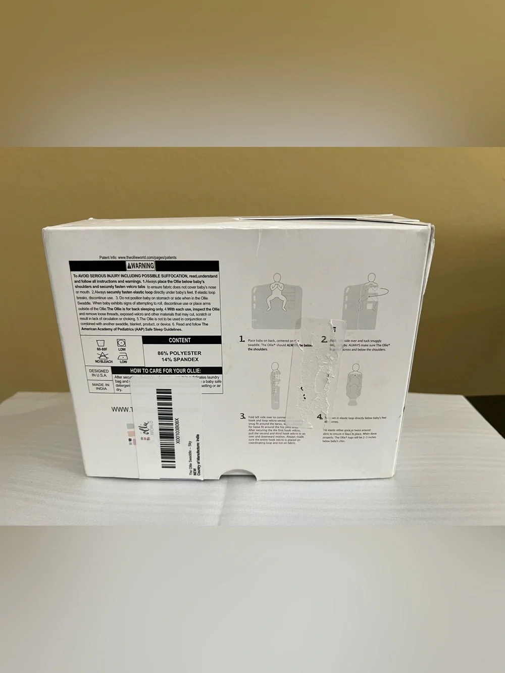The Ollie Adjustable Swaddle For Newborns. Color: Sky. NEW IN OPEN BOX